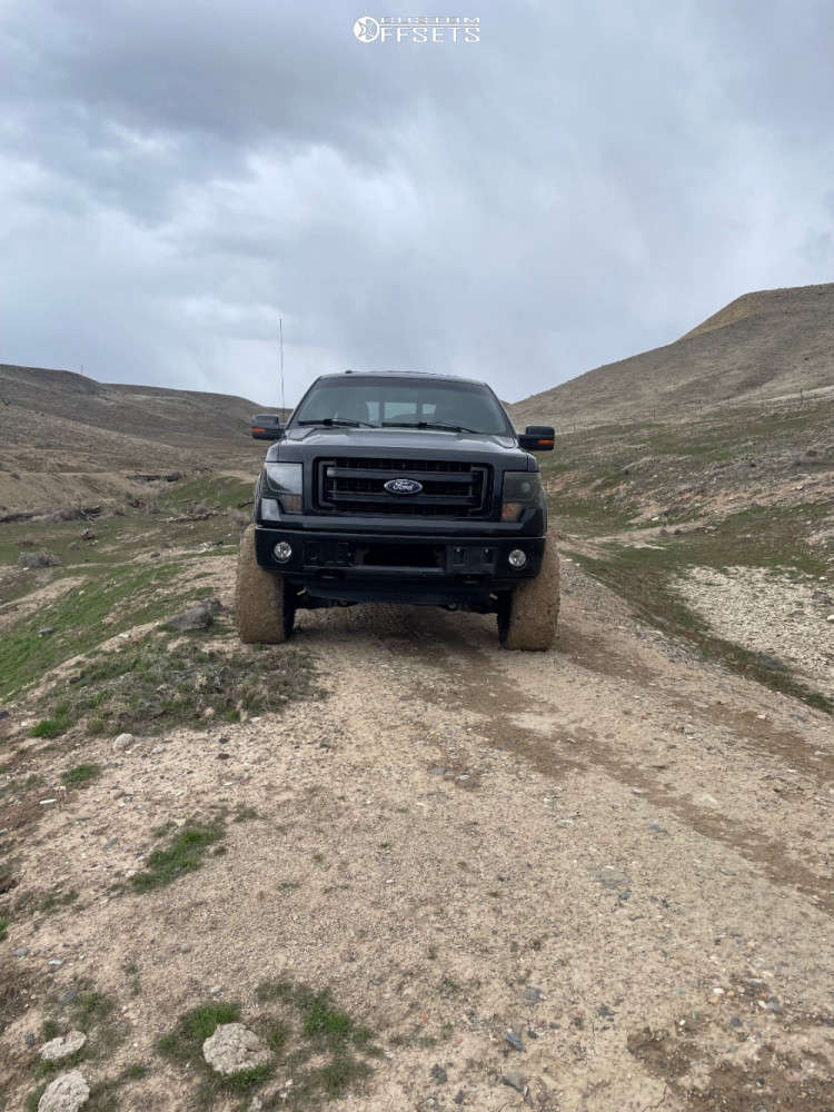 2013 Ford F150 with 22x12 44 Fuel Hostage and 35/12.5R22 Nitto Mud