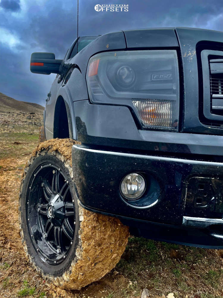 2013 Ford F150 with 22x12 44 Fuel Hostage and 35/12.5R22 Nitto Mud