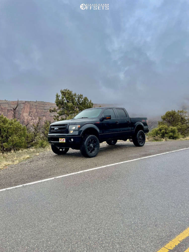 2013 Ford F150 with 22x12 44 Fuel Hostage and 35/12.5R22 Nitto Mud