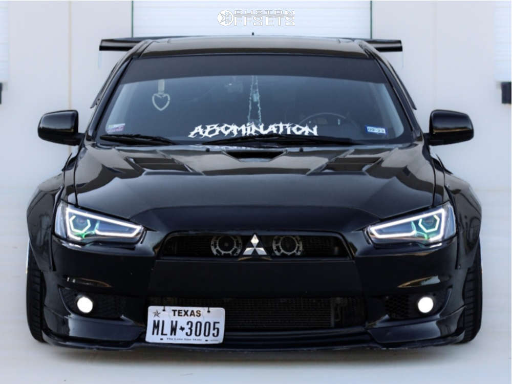 2009 Mitsubishi Lancer with 18x10.5 15 Aodhan Ds02 and 255/40R18