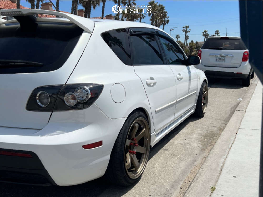 2009 Mazda 3 with 18x9.5 38 AVID1 Av6 and 225/40R18 Vercelli