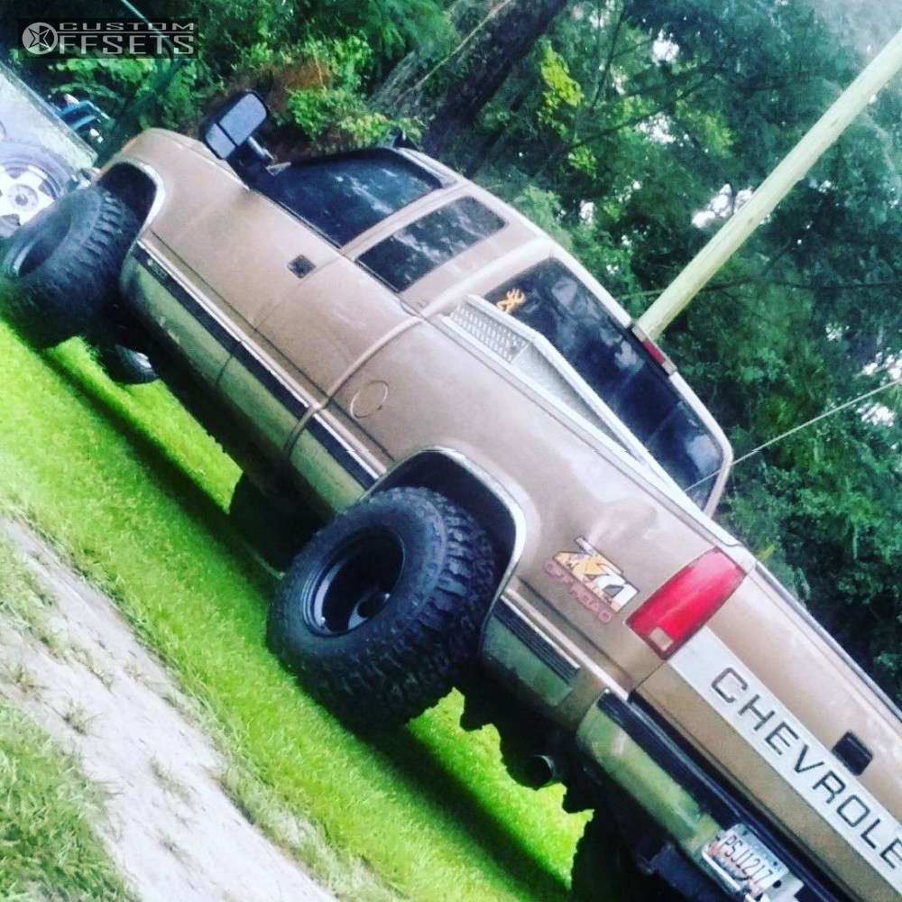 1994 Chevrolet K1500 with 15x12 -63 Black Rock 997 and 33
