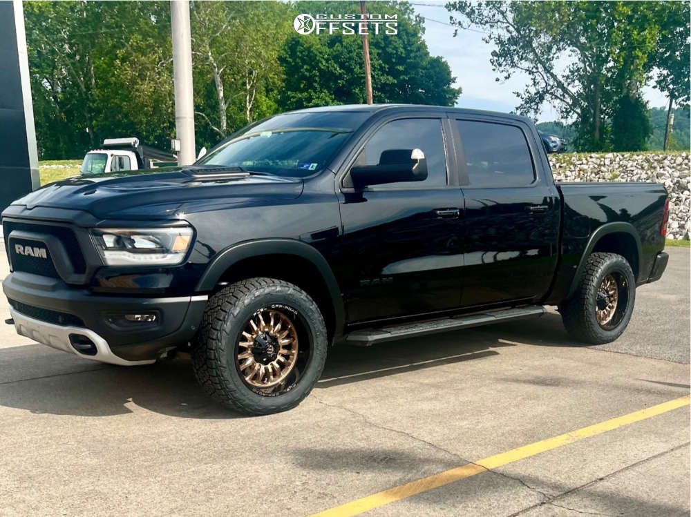 2019 Ram 1500 with 20x10 18 Fuel Arc and 285/55R20 Nitto Recon