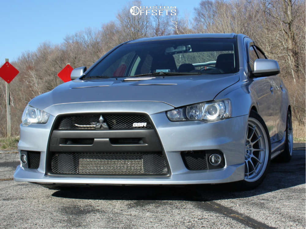 2008 Mitsubishi Lancer with 18x9.5 27 Enkei NT03M and 255