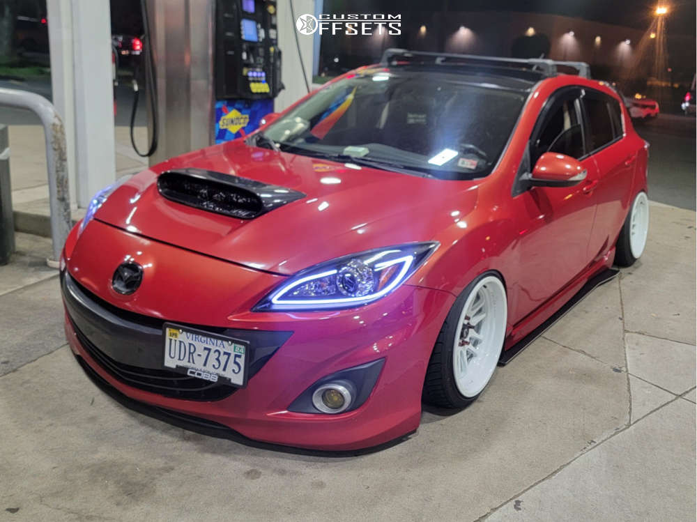 2012 Mazda 3 with 17x9 5 Cosmis Racing Xt-206r and 205/40R17 Nitto