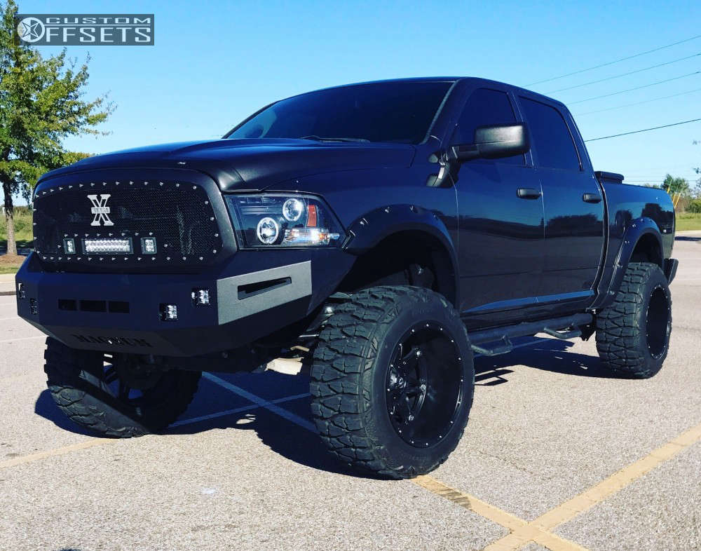 2015 Ram 1500 with 22x14 76 Fuel Hostage and 37/13.5R22 Nitto Mud
