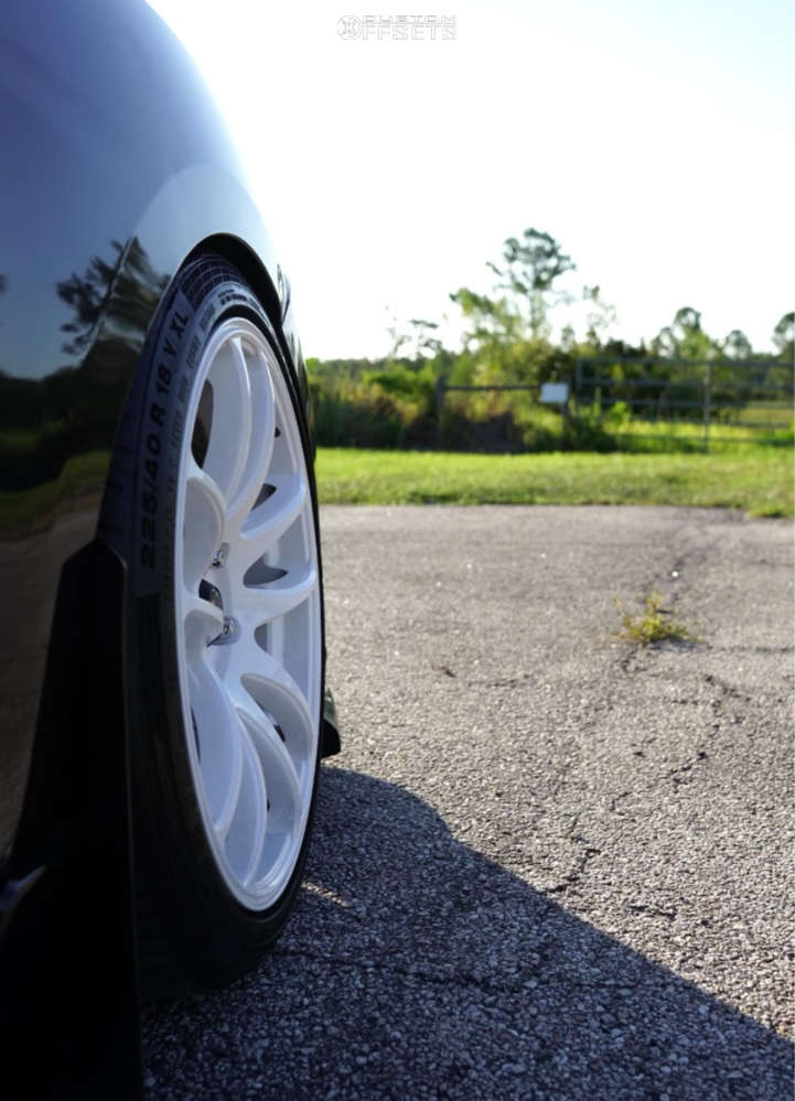 2010 Mazda 3 with 18x8.5 35 Vors Tr4 and 225/40R18 Continental