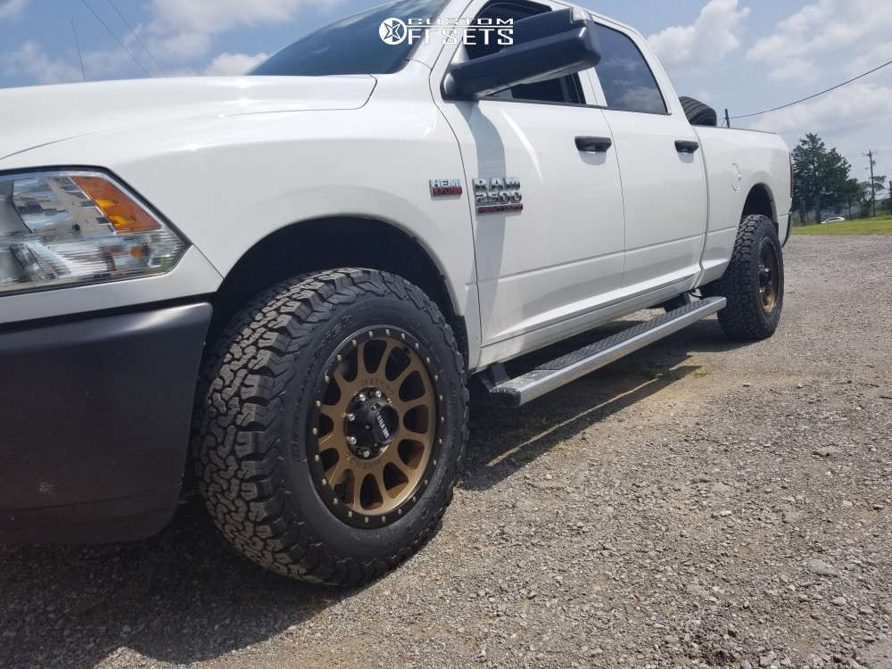 2014 Ram 2500 with 20x9 18 Method Nv and 275/65R20 BFGoodrich All Terrain Ta Ko2 and Stock