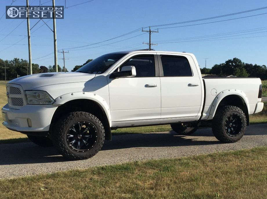 2014 Ram 1500 with 20x12 44 Fuel Throttle and 35/12.5R20 Nitto Trail Grappler and Suspension