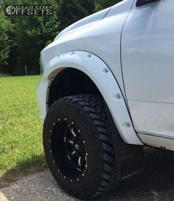 2014 Ram 1500 with 20x12 44 Fuel Throttle and 35/12.5R20 Nitto Trail Grappler and Suspension