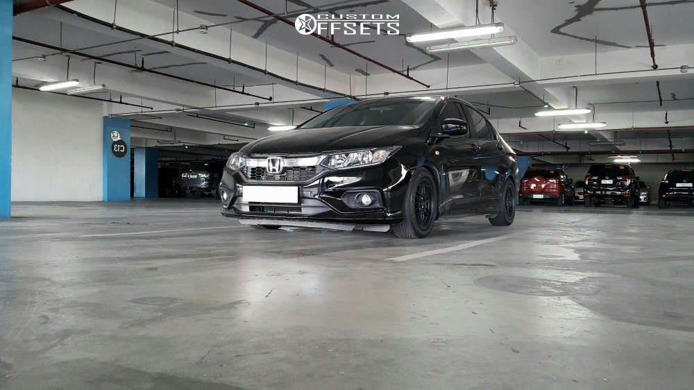 2018 Honda Fit with 15x7 38 Rota TFS301 and 195/55R15 Nankang Ns