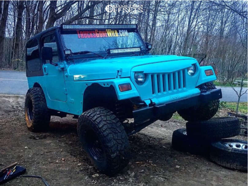 2001 Jeep TJ with 15x8 19 American Racing Baja and 32/11.5R15 Mud Claw