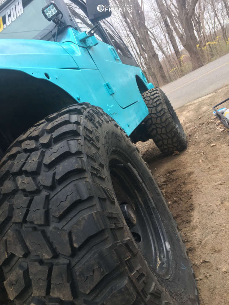 2001 Jeep TJ with 15x8 19 American Racing Baja and 32/11.5R15 Mud Claw