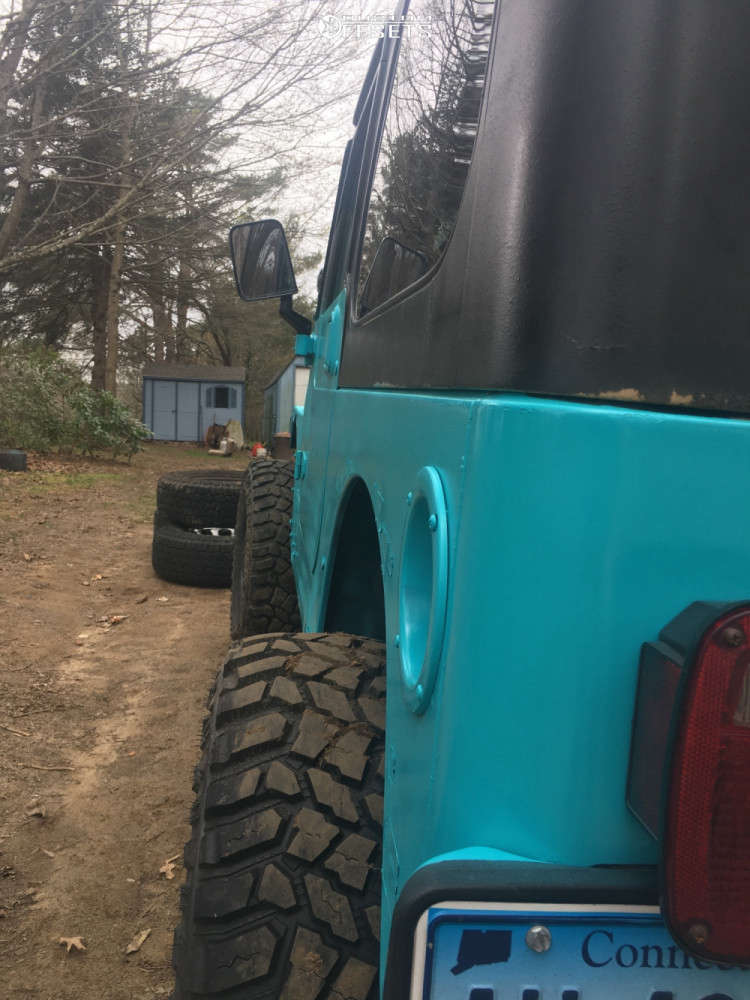 2001 Jeep TJ with 15x8 19 American Racing Baja and 32/11.5R15 Mud Claw
