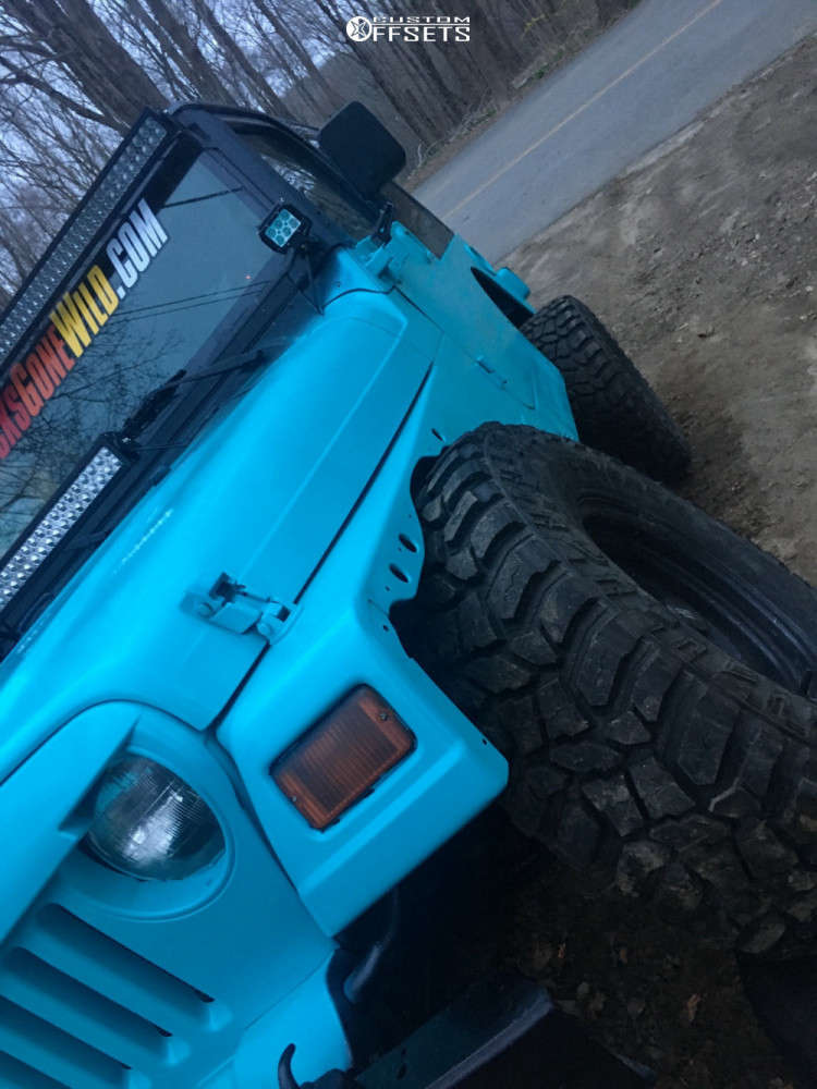 2001 Jeep TJ with 15x8 19 American Racing Baja and 32/11.5R15 Mud Claw