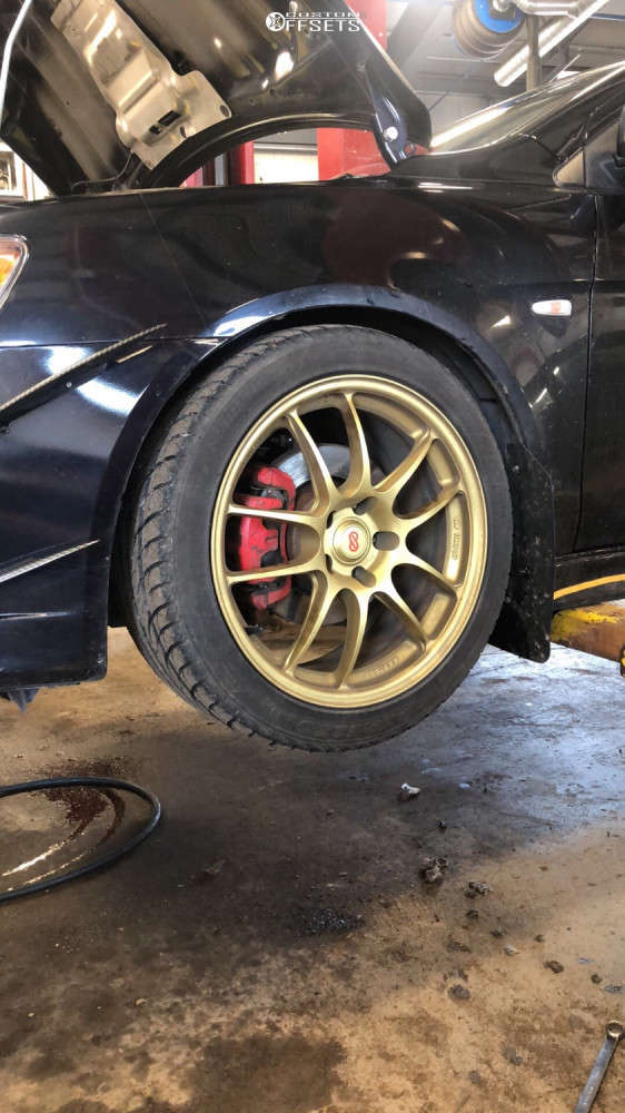 2009 Mitsubishi Lancer with 18x8 45 Enkei Pf01 and 245/40R18