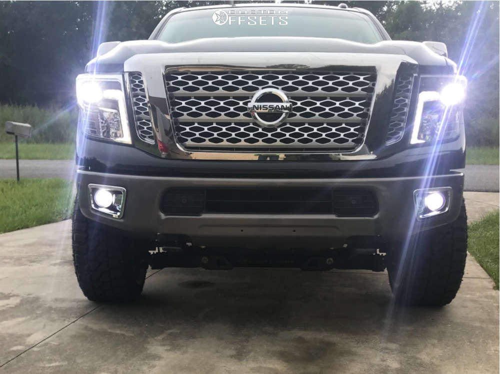 2016 Nissan Titan XD with 22x12 44 XF Xfx306 and 33/12.5R22 Fury Offroad Country Hunter