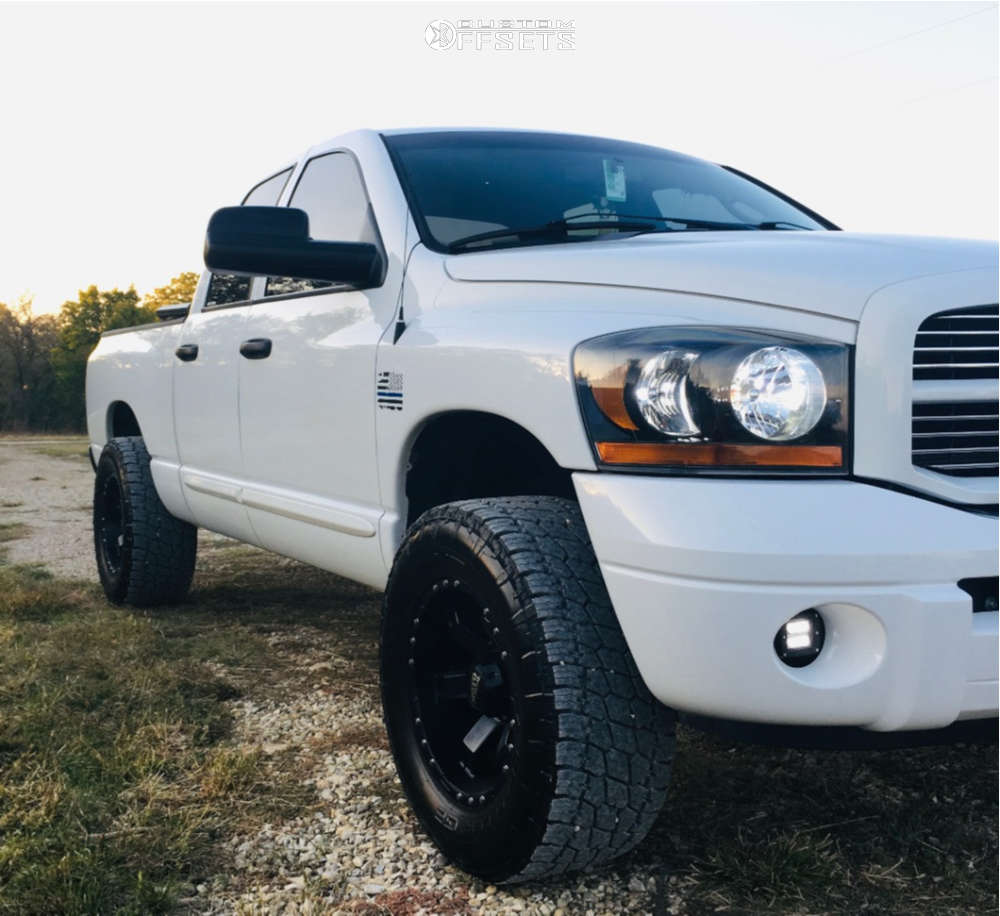 2006 Dodge Ram 1500 with 18x10 -24 Moto Metal Mo967 and 325/60R18 Nitto ...