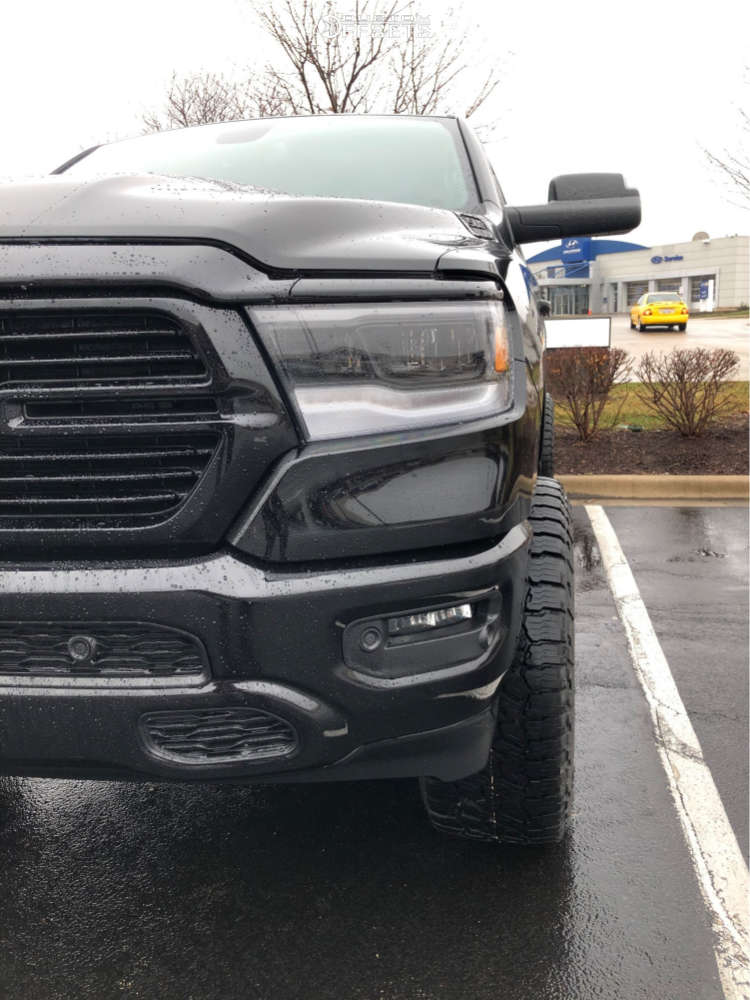 2019 Ram 1500 with 20x10 24 Moto Metal Mo986 and 35/12.5R20 Falken