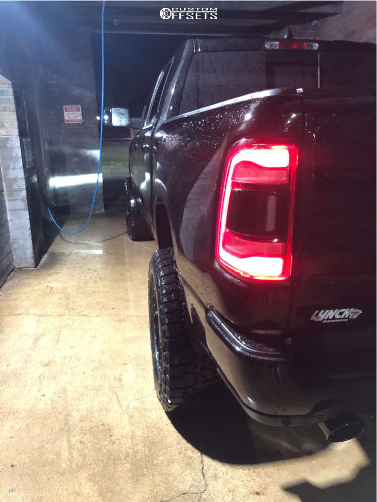 2019 Ram 1500 with 20x10 24 Moto Metal Mo986 and 35/12.5R20 Falken