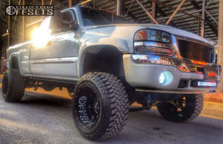 2006 GMC Sierra 1500 with 20x14 76 Fuel Hostage and 36/15.5R20 Mickey