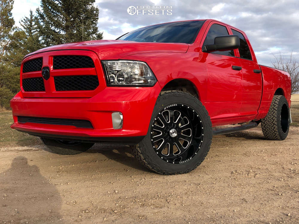 2014 Ram 1500 with 22x12 44 XF Xfx302 and 35/12.5R22 Venom Power Terra Hunter X/t and