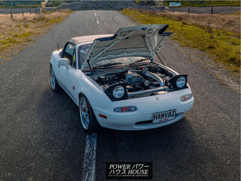 1989 Mazda Miata with 17x7 36 Blitz Technospeed Z1 and 205/40R17