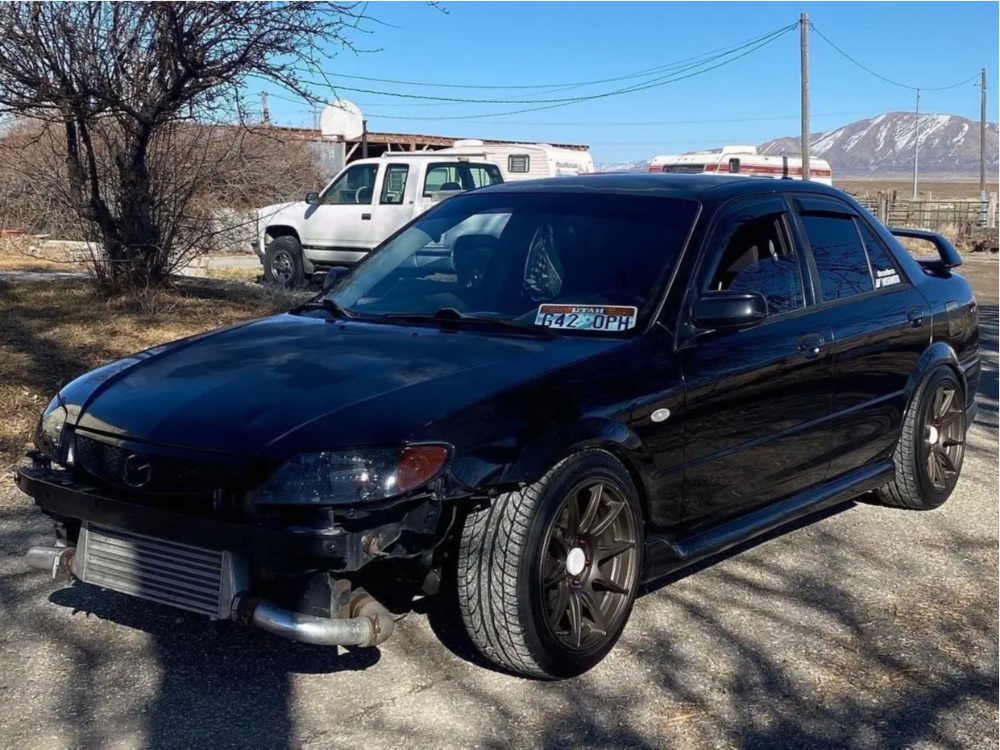 2003 Mazda Protege with 17x8.25 25 XXR 527 and 215/40R17 Nexen