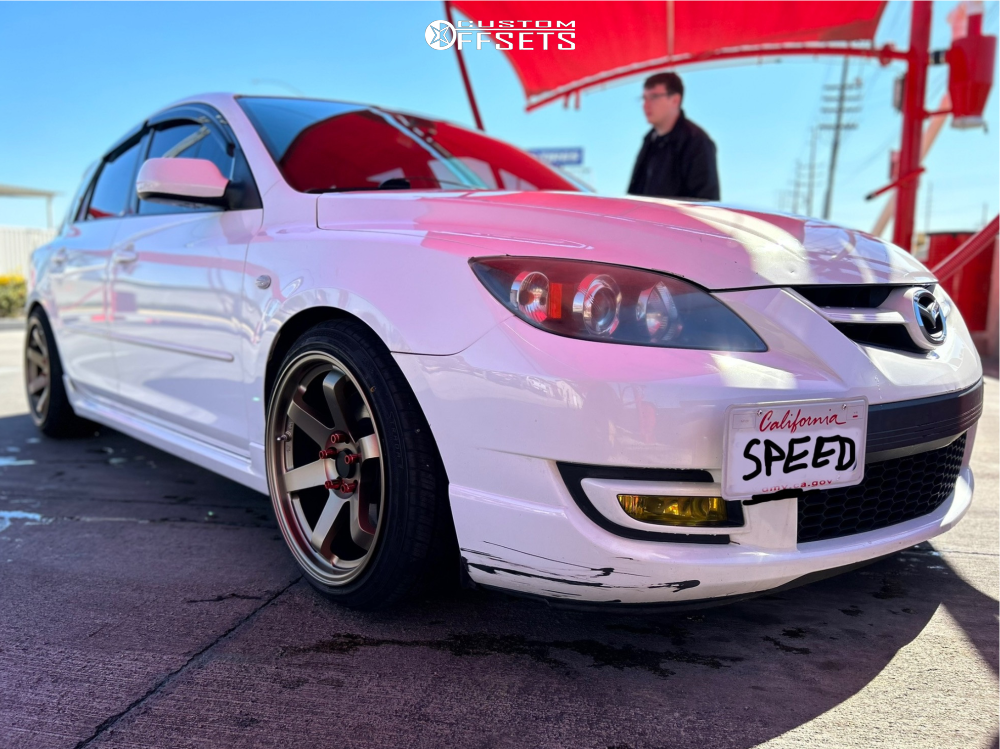 2009 Mazda 3 with 18x9.5 38 AVID1 Av6 and 225/40R18 Vercelli