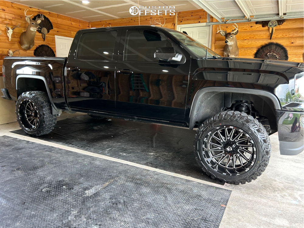 2016 GMC Sierra 1500 with 22x12 -44 TIS 547bm and 35/12.5R22